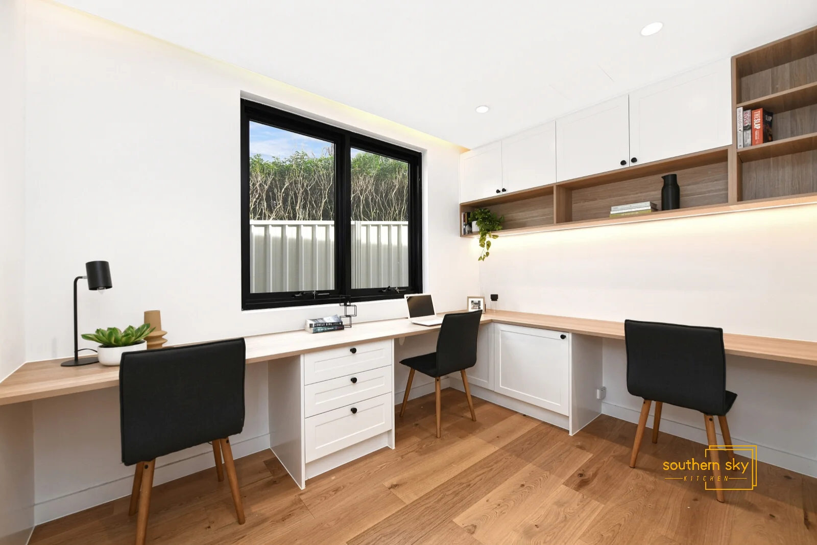 Sleek workspace design with premium craftsmanship, featuring modern, minimalist cabinetry and chic, versatile desks for ultimate productivity.