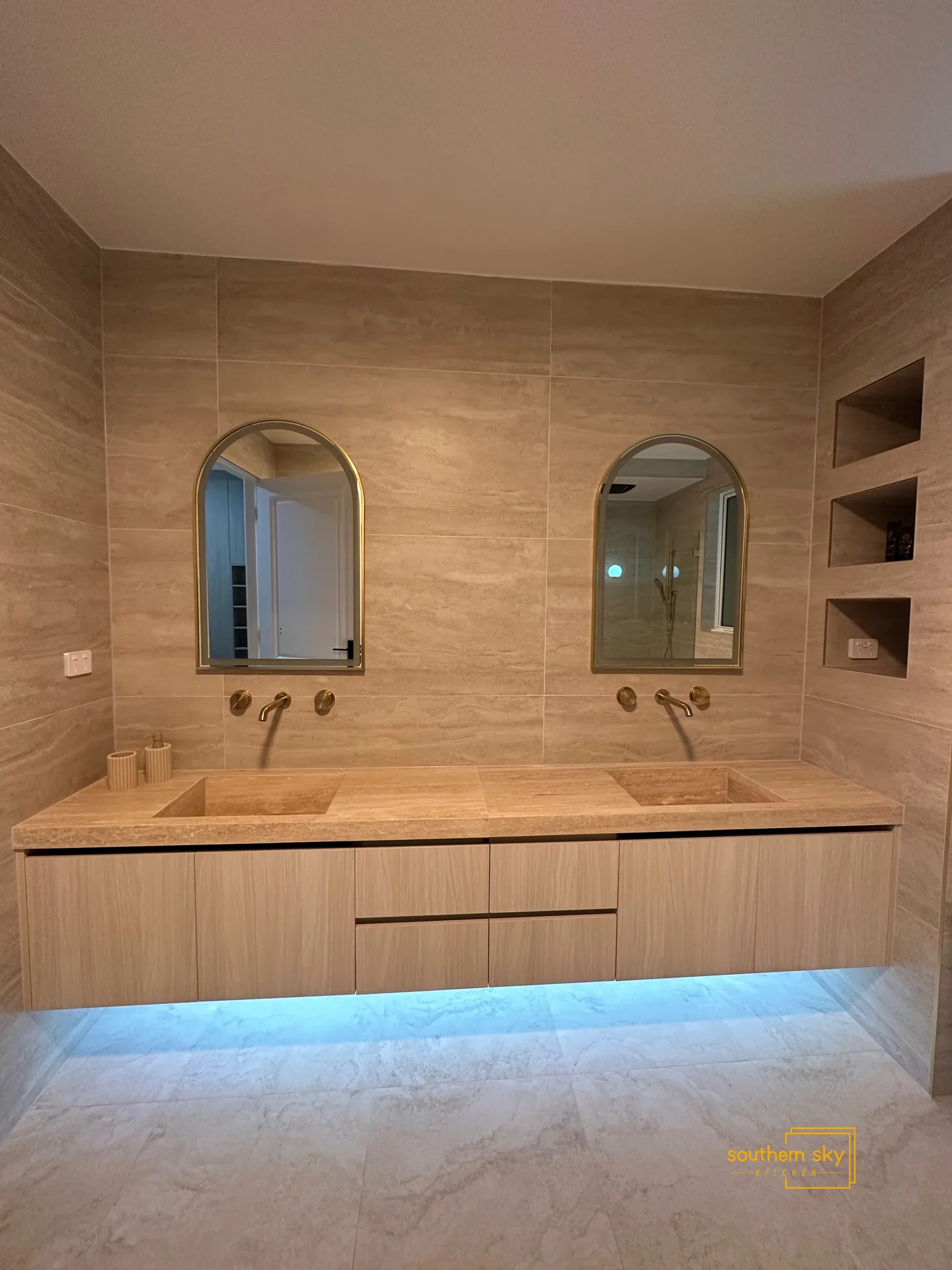 Elegant double vanity with gold accents; modern design meets craftsmanship, elevating your bathroom's luxury aesthetic.