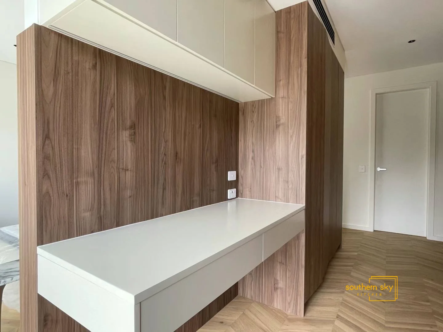 Sleek desk with walnut finish, showcasing expert craftsmanship and modern elegance. Perfect for any sophisticated space.