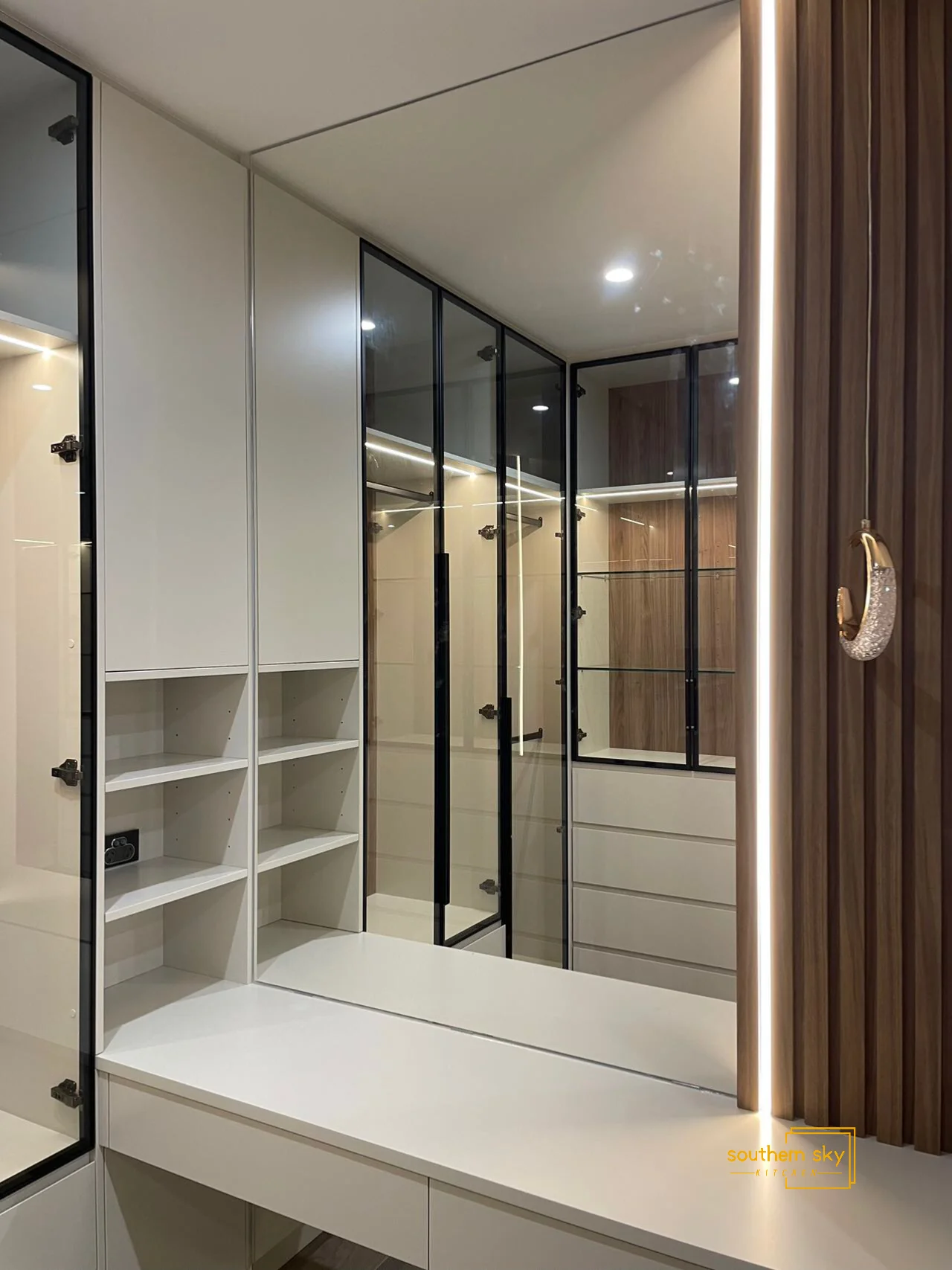 Sleek modern wardrobe showcasing impeccable craftsmanship, elegant glass, and refined wood finish—designed for ultimate luxury.