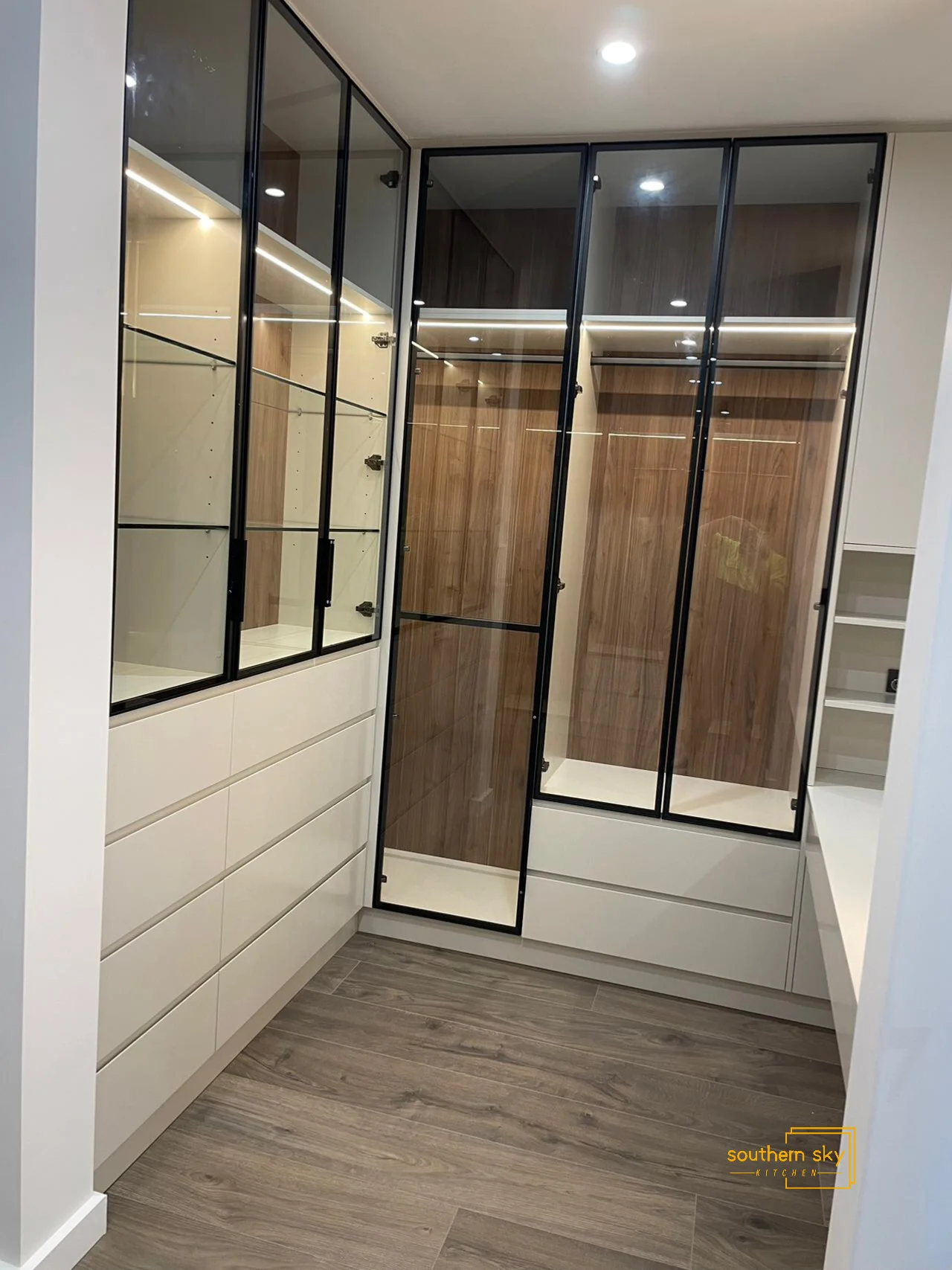 Sleek, modern cabinetry showcasing superior craftsmanship and design, highlighted by elegant glass doors and sophisticated finishes.