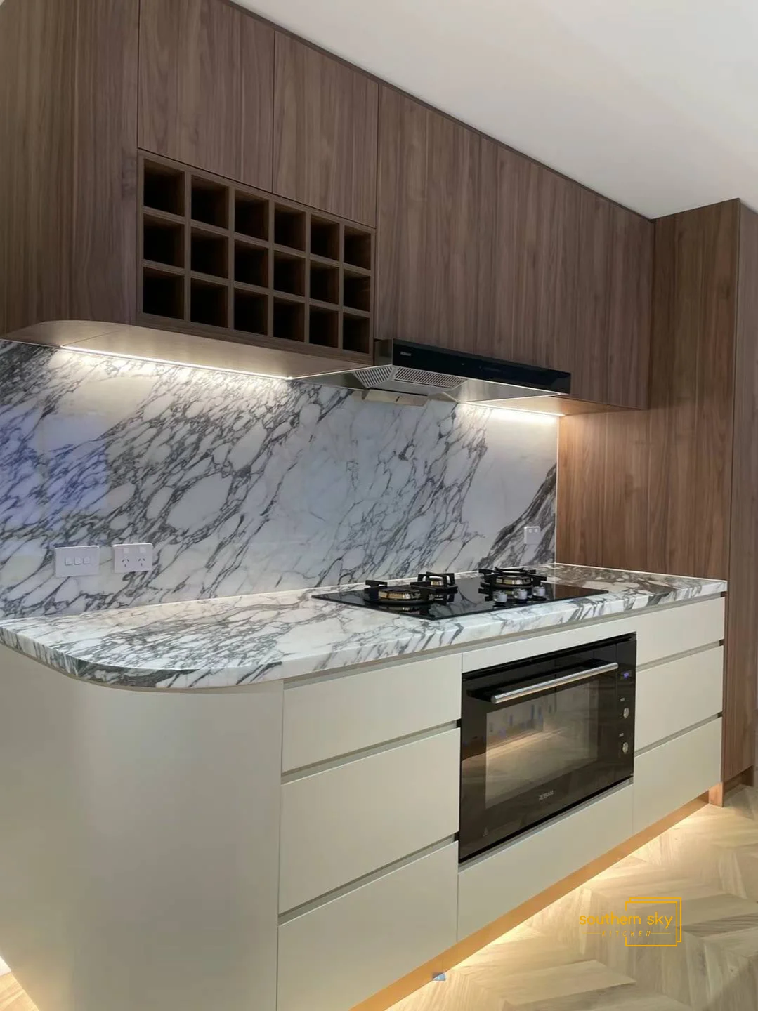 Luxurious kitchen design with exquisite marble countertops, sleek cabinetry, and sophisticated wood finishes. Elevate your space.