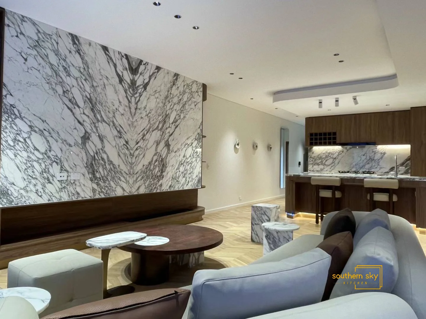 Luxurious living space with exquisite marble accents and sleek design, highlighting superior craftsmanship and modern elegance.