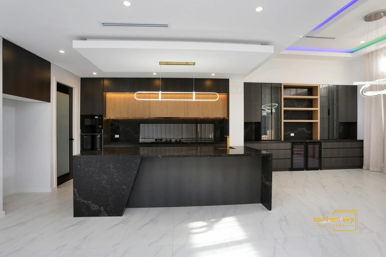 Sleek modern kitchen with exquisite craftsmanship and elegant black marble detailing, showcasing superior design excellence.