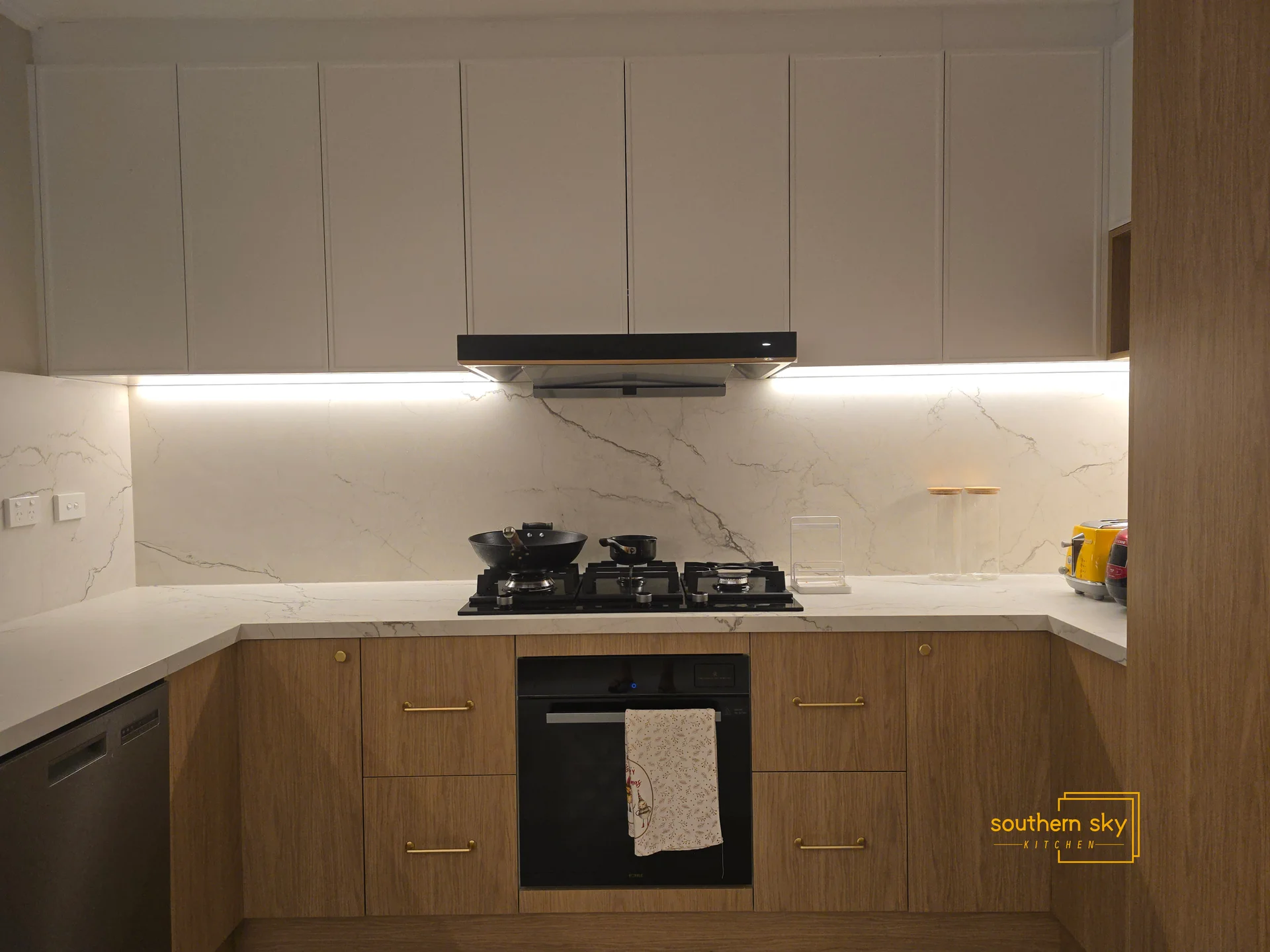 Elegant kitchen design with flawless craftsmanship, sleek cabinetry, and a luxurious marble finish for a modern aesthetic.