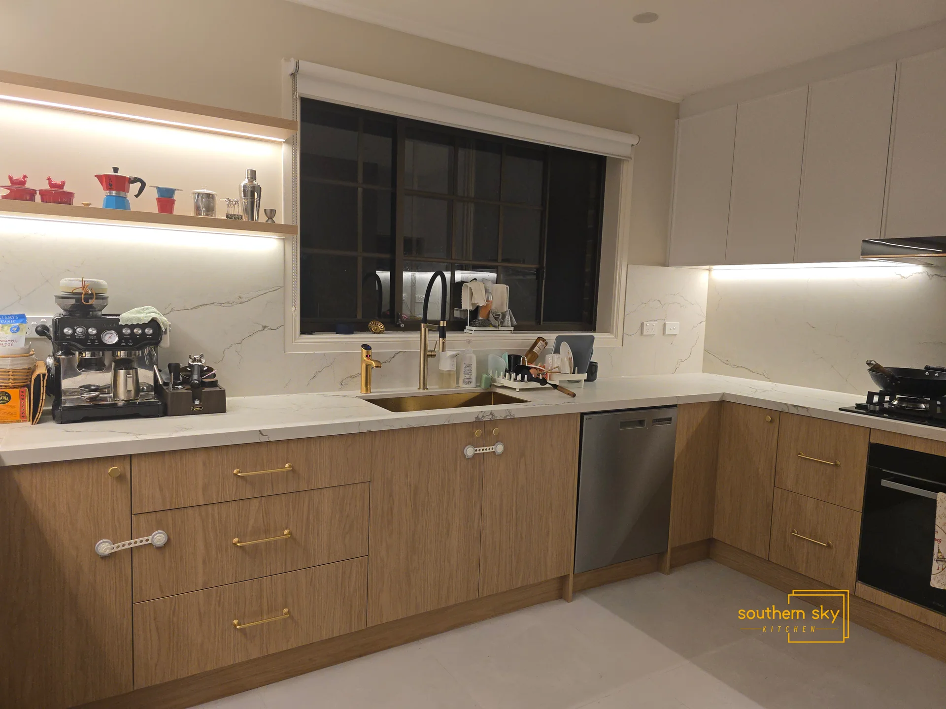 Elegant kitchen with premium wood cabinetry, sleek marble countertops, and modern design, showcasing top-notch craftsmanship.