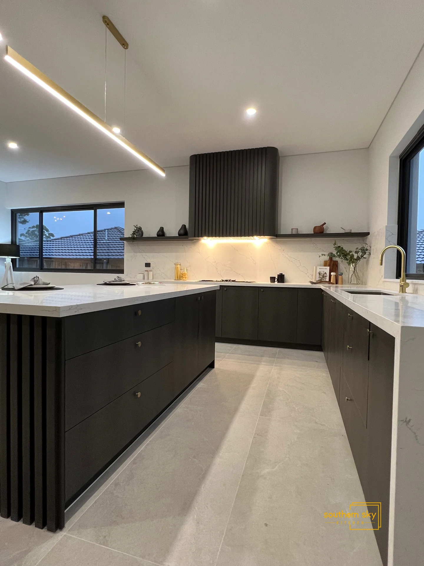 Sleek modern kitchen design with premium finishes, exquisite craftsmanship, and elegant lighting for sophisticated living.