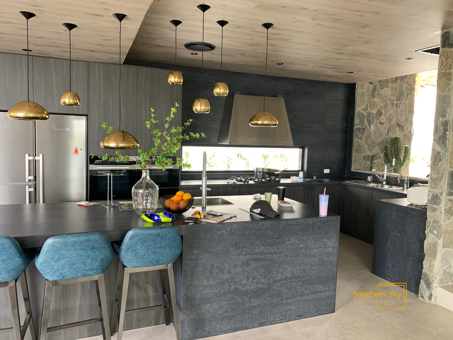 Luxurious kitchen design with sleek, modern finishes, gold fixtures, and premium materials. Elegance redefined for your home.