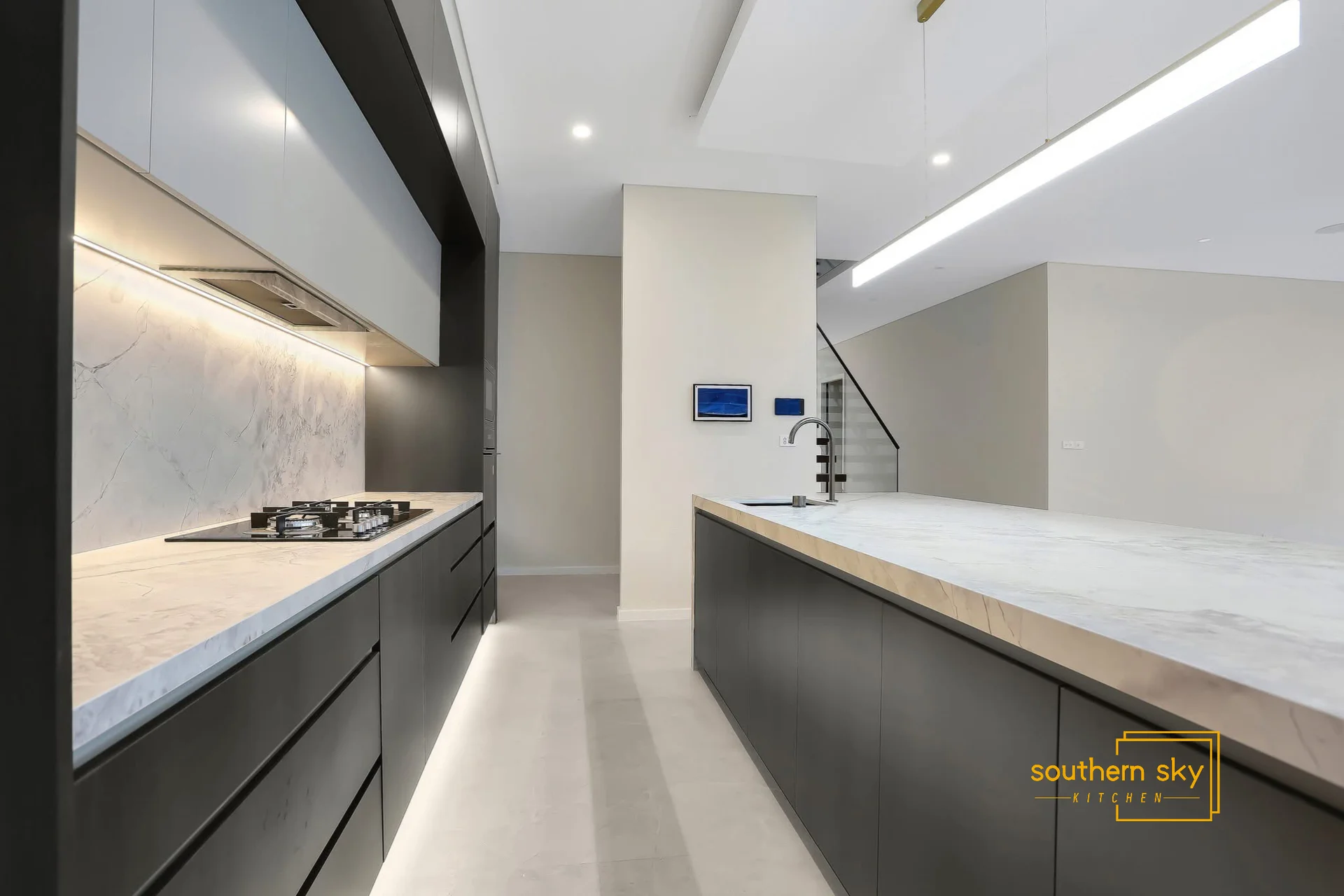Sleek kitchen design with exquisite craftsmanship, featuring elegant marble countertops and modern finishes for ultimate sophistication.
