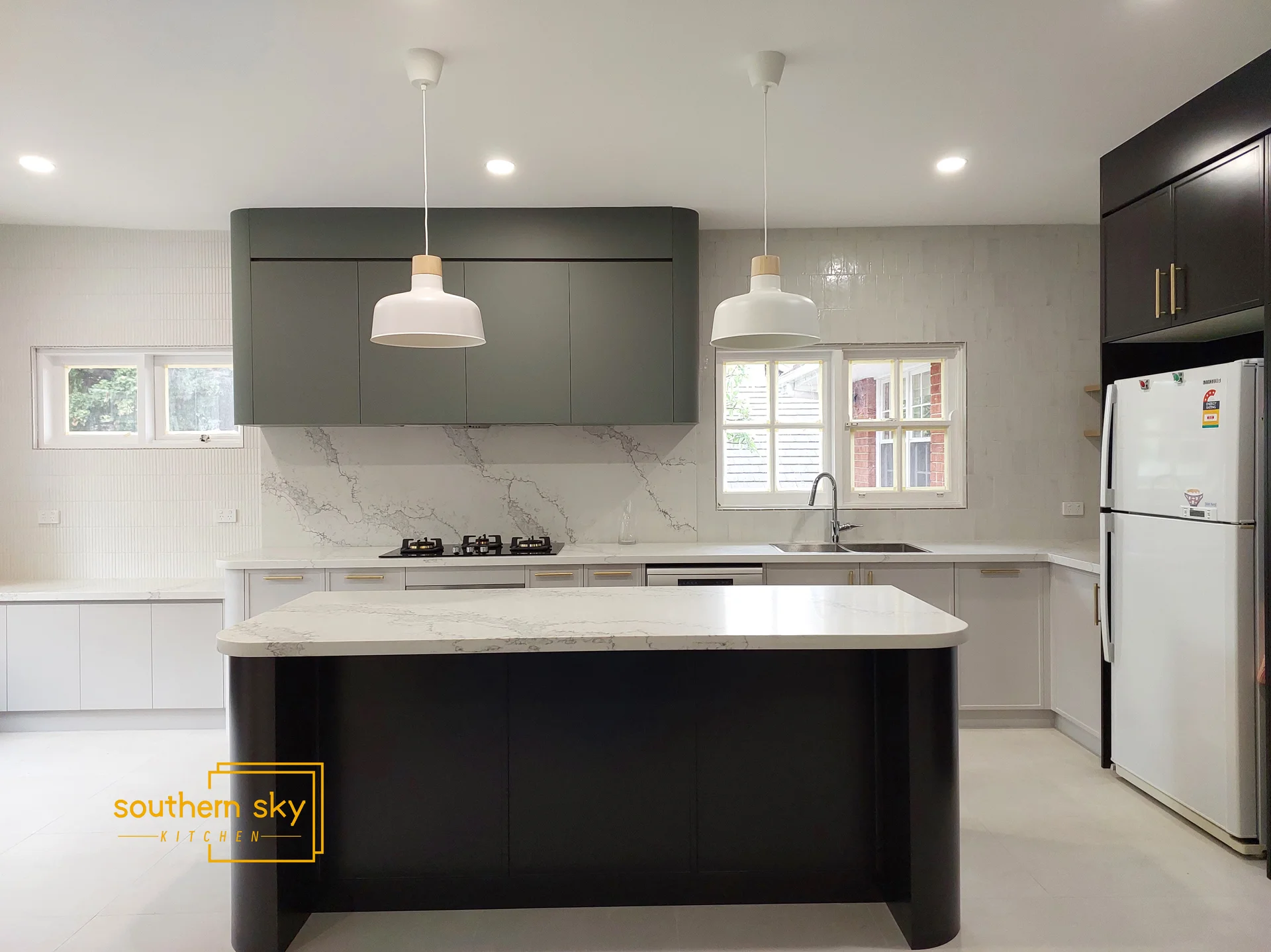 Sleek modern kitchen featuring exquisite craftsmanship, elegant design, and premium materials for a refined culinary space.