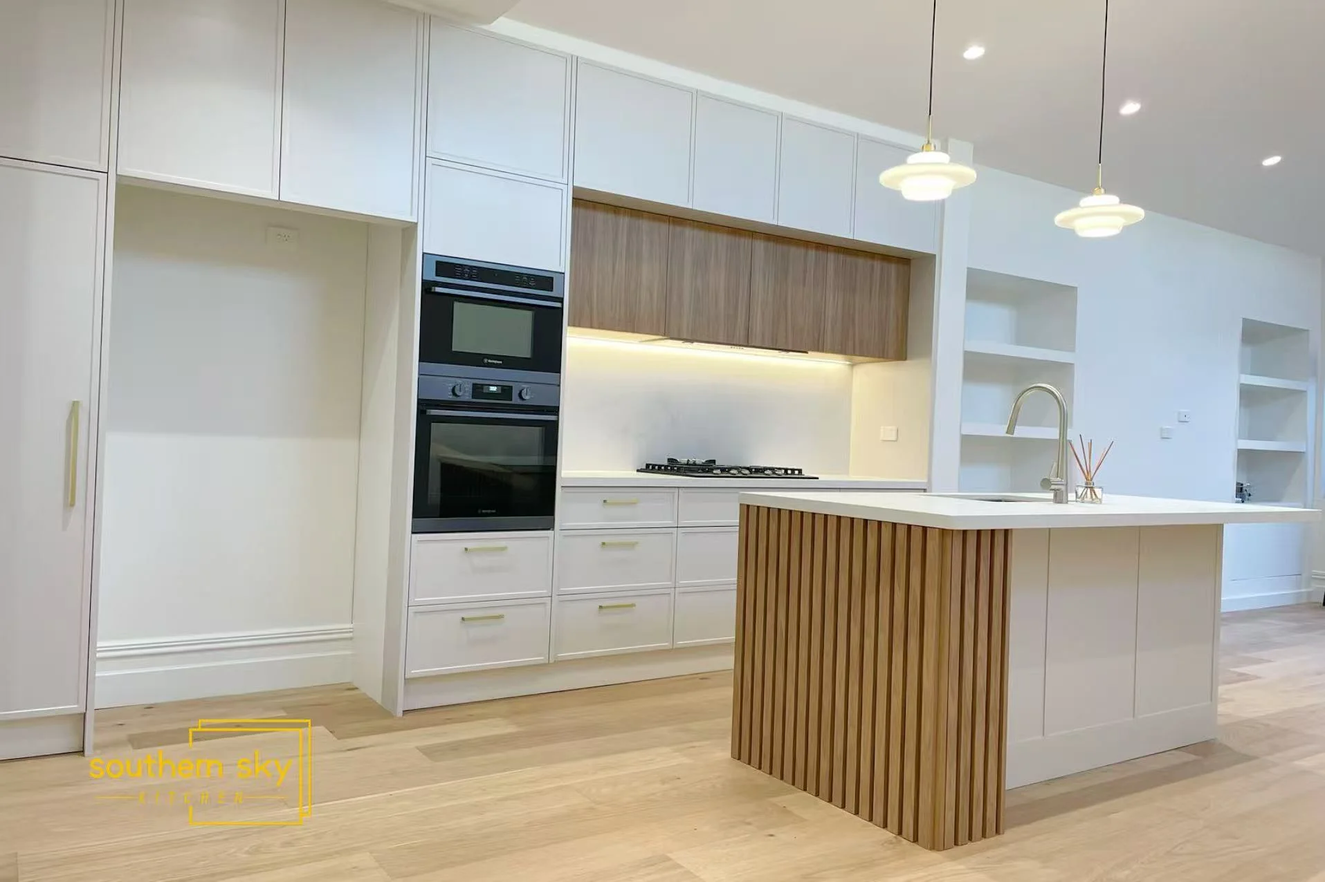 Sleek kitchen design with high-end appliances and elegant wood accents. Expert craftsmanship meets modern functionality.