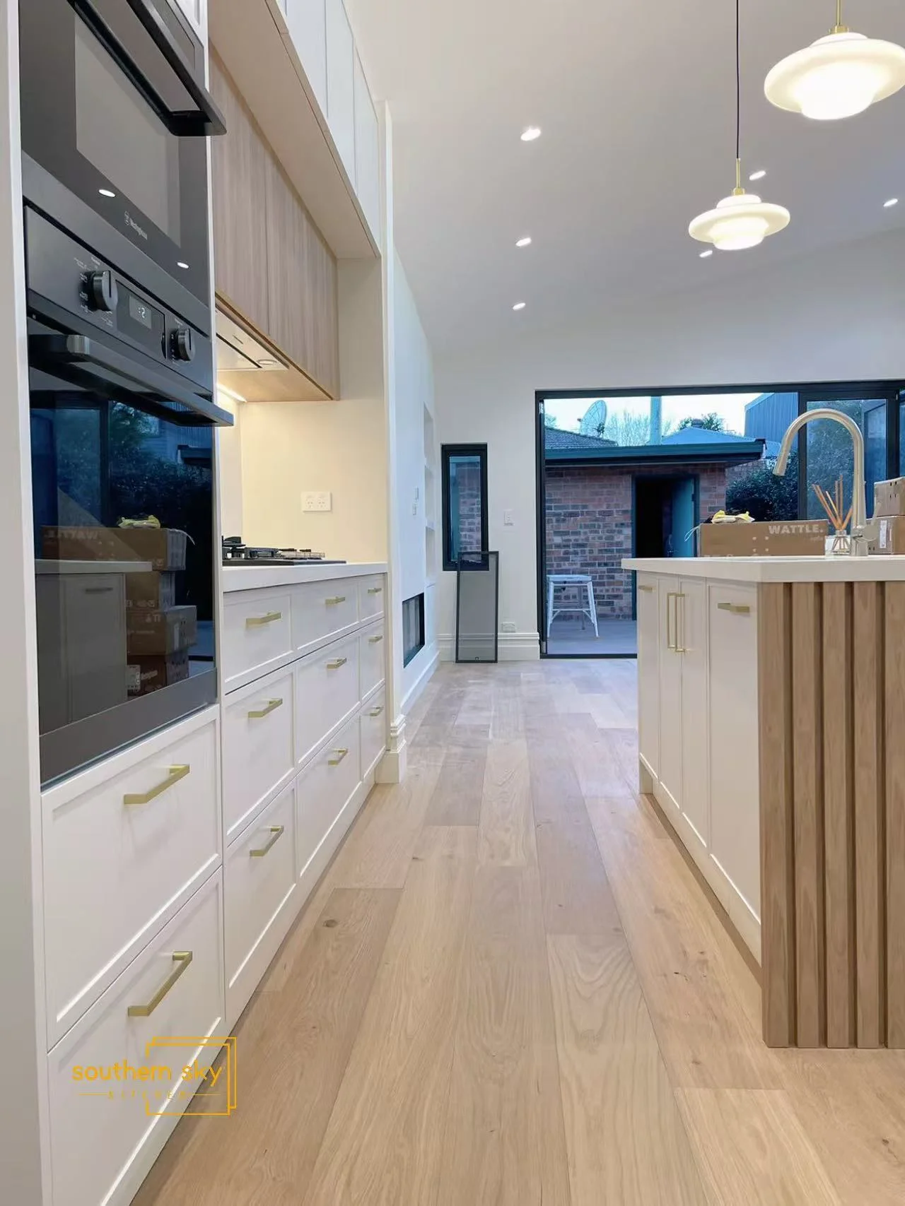 Elegant kitchen with exquisite craftsmanship, sleek cabinetry, and modern lighting—a blend of style and functionality.