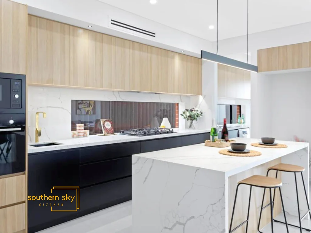 Sleek kitchen design with exquisite craftsmanship, luxurious marble finishes, and modern elegance for a sophisticated space.